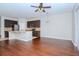 Open concept dining area adjacent to kitchen with hardwood floors at 4978 White Sanderling Ct, Tampa, FL 33619