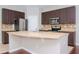 Modern kitchen with stainless steel appliances and an island at 4978 White Sanderling Ct, Tampa, FL 33619