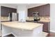 Modern kitchen with stainless steel appliances and an island at 4978 White Sanderling Ct, Tampa, FL 33619