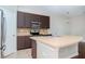 Updated kitchen with stainless steel appliances and an island at 4978 White Sanderling Ct, Tampa, FL 33619