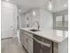 Kitchen island with quartz countertops and stainless steel appliances at 6258 Broad Field Ave, Apollo Beach, FL 33572