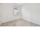 Well-lit bedroom featuring plush carpeting and window at 9415 Coastline Way, Parrish, FL 34219