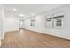 Light and airy living room with wood-look floors and plenty of natural light at 9415 Coastline Way, Parrish, FL 34219