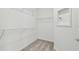 Large walk-in closet with wire shelving at 9415 Coastline Way, Parrish, FL 34219