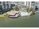 Gorgeous clubhouse, pool, and lounging area at this beautiful waterfront condo complex at 9495 Blind Pass Rd # 206, St Pete Beach, FL 33706