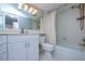 Functional bathroom featuring a vanity with drawers and a shower-tub combination, creating a practical space at 9495 Blind Pass Rd # 206, St Pete Beach, FL 33706