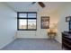 Inviting bedroom featuring a ceiling fan, large windows, and plush carpeting, creating a comfortable space at 9495 Blind Pass Rd # 206, St Pete Beach, FL 33706