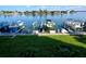 Private boat dock on the bay with a lift, providing quick ocean access and picturesque waterfront views at 9495 Blind Pass Rd # 206, St Pete Beach, FL 33706