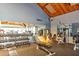 Community gym with a variety of machines, free weights, and mirrored walls for residents to stay active and healthy at 9495 Blind Pass Rd # 206, St Pete Beach, FL 33706