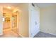 Hallway featuring closet with mirrored doors, a standard closet and partial view to the bathroom at 9495 Blind Pass Rd # 206, St Pete Beach, FL 33706