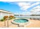 Outdoor hot tub with lounge chairs and a view of the waterway at 9495 Blind Pass Rd # 206, St Pete Beach, FL 33706