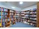 A cozy library nook with floor-to-ceiling bookshelves filled with literary treasures, creating a perfect reading retreat at 9495 Blind Pass Rd # 206, St Pete Beach, FL 33706