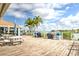 Outdoor deck with grills and picnic tables overlooking the water at 9495 Blind Pass Rd # 206, St Pete Beach, FL 33706