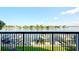 Beautiful water views from the balcony, with boat docks, green grass, and blue sky at 9495 Blind Pass Rd # 206, St Pete Beach, FL 33706