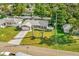 Aerial view of the home and surrounding landscaping and neighborhood at 13084 Drysdale St, Spring Hill, FL 34609