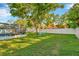 Spacious backyard featuring a fire pit and screened-in patio at 13084 Drysdale St, Spring Hill, FL 34609