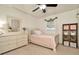 Cozy bedroom with neutral walls, carpet flooring, and natural light from the window at 13084 Drysdale St, Spring Hill, FL 34609
