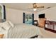 Primary bedroom boasts sliding glass doors to pool, and a ceiling fan at 13084 Drysdale St, Spring Hill, FL 34609