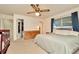 Bright bedroom with a ceiling fan, a wardrobe, and a comfortable bed at 13084 Drysdale St, Spring Hill, FL 34609
