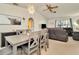 Dining room with open layout to the living room, gray table, and decorative lighting at 13084 Drysdale St, Spring Hill, FL 34609