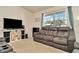 Living room with plush sofa, mounted TV, and home decor at 13084 Drysdale St, Spring Hill, FL 34609