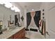 Bathroom with granite vanity and shower/tub combo at 1361 Emerald Dunes, Sun City Center, FL 33573