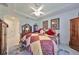 Bedroom with king-size bed and adjacent bathroom access at 1361 Emerald Dunes, Sun City Center, FL 33573