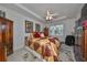 Bright bedroom with king-size bed and ample closet space at 1361 Emerald Dunes, Sun City Center, FL 33573