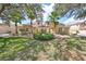 Beautiful 2-story building with lush landscaping and a pergola entrance at 1361 Emerald Dunes, Sun City Center, FL 33573