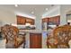 Island kitchen with granite counters and breakfast bar at 1361 Emerald Dunes, Sun City Center, FL 33573