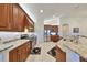 Gourmet kitchen with granite countertops and wood cabinets at 1361 Emerald Dunes, Sun City Center, FL 33573