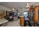 Spacious living room with water view, wet bar, and granite countertops at 1361 Emerald Dunes, Sun City Center, FL 33573