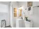 Clean bathroom with white vanity, fixtures, and tiled shower at 2601 N 19Th St, Tampa, FL 33605