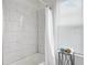 Bathroom with white tiled shower and bathtub at 2601 N 19Th St, Tampa, FL 33605