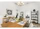 Spacious dining area with a wooden table and view to Primary bedroom at 2601 N 19Th St, Tampa, FL 33605