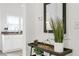 Bright entryway with console table, plants, and view of kitchen at 2601 N 19Th St, Tampa, FL 33605