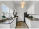Modern kitchen with white cabinets, granite counters, and wood floors at 2601 N 19Th St, Tampa, FL 33605