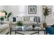 Living room with a neutral sofa and glass coffee table at 2601 N 19Th St, Tampa, FL 33605