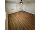 Bright bedroom with hardwood floors and double closets at 9841 San Sebastian Way, Port Richey, FL 34668