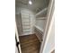 Bright walk-in closet, built-in shelves, and hanging rods at 9841 San Sebastian Way, Port Richey, FL 34668