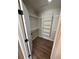 Large walk-in closet with shelving and hanging rods at 9841 San Sebastian Way, Port Richey, FL 34668