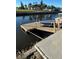 Private dock with steps leading to the water at 9841 San Sebastian Way, Port Richey, FL 34668