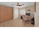 Bright home office features built-in cabinets and hardwood floors at 9841 San Sebastian Way, Port Richey, FL 34668