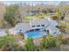 Home with pool and large covered patio, surrounded by trees at 17307 Linda Vista Cir, Lutz, FL 33548