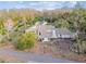 Aerial view of two-story house nestled in lush greenery at 17307 Linda Vista Cir, Lutz, FL 33548