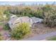 Aerial view of a two-story house with surrounding trees at 17307 Linda Vista Cir, Lutz, FL 33548