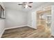 Spacious bedroom with wood-look floors and ceiling fan at 17307 Linda Vista Cir, Lutz, FL 33548