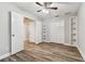 Charming bedroom with built in shelving and wood-look floors at 17307 Linda Vista Cir, Lutz, FL 33548