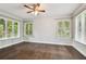 Bedroom with hardwood floors and multiple windows at 17307 Linda Vista Cir, Lutz, FL 33548
