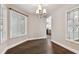 Bright dining room with hardwood floors, chandelier, and built-in window seat at 17307 Linda Vista Cir, Lutz, FL 33548